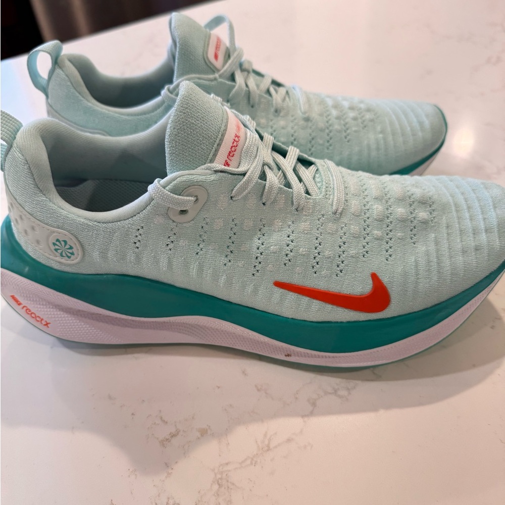 Nike Light Green Athletic Sneakers with Red Swoosh